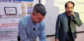 Michael Bialko of Kodak cutting the cake. Photo PSA