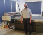 Deepanshu Goel managing director of Creative Graphics, with the new Kongsberg X table at Creative's new headquarter plant in Noida Photo Esko