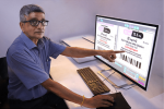 Rajesh Nema, Pragati’s executive director demonstrates the Baldwin OLP inspection system. Photo Pragati Graphics Indore