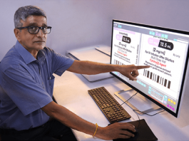 Rajesh Nema, Pragati’s executive director demonstrates the Baldwin OLP inspection system. Photo Pragati Graphics Indore