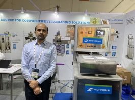 Parag Patwardhan, vice-president of Sales and Marketing at Nichrome displays Athena MAP (modified atmosphere packaging) food tray sealing packaging machine at PackPlus 2022. Photo: PSA