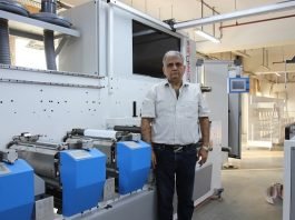 Abhay Datta, director, UV Graphics, with the Ultraflex UFO-450 10-color dual servo LED UV combo film and label press containing 42 servo drivers at his plant. Photo: PSA