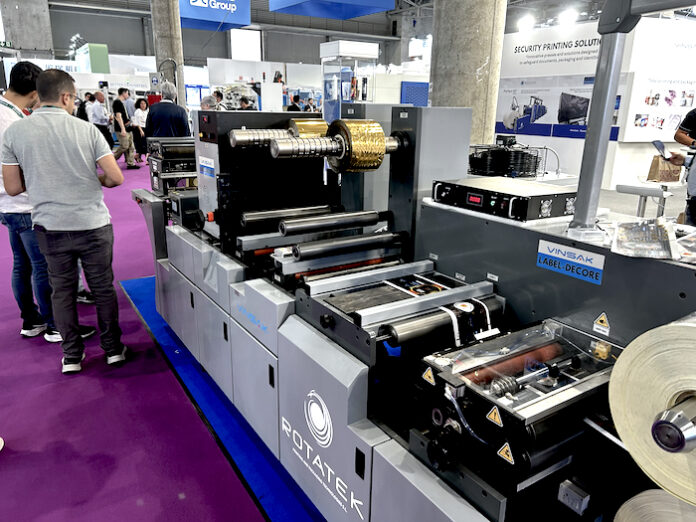 IMG_5562–Vinsak At Hall 4, Booth 4D22, Vinsak is showing its Label-Decore, an advanced modular label finishing machine designed for high-quality embellishments and flexible configurations. Attendees are witnessing live demonstrations of the Label-Decore in action, showcasing its capabilities in label converting, decoration, and premium finishing.