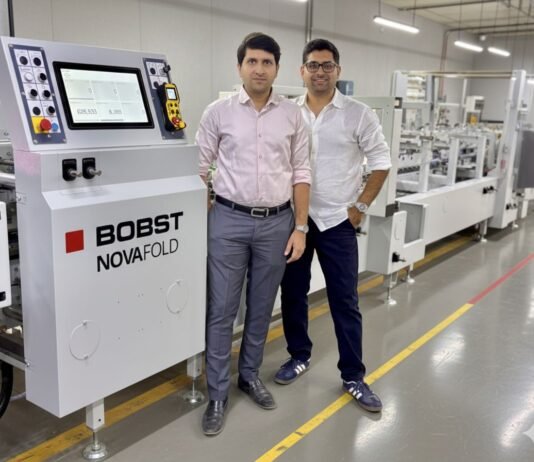 Vaibhav and Vishal Kothari of Integrity Packaging with Bobst Novafold folder gluer