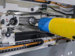 Flexcel Prime plate on a sleeve being inserted into the press Photo Miraclon