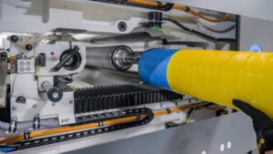 Flexcel Prime plate on a sleeve being inserted into the press Photo Miraclon