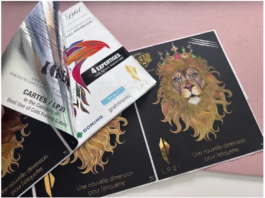 In this image, the monochrome variable print visible on the peeled‑back foil adhesive layer was produced by the K600i; the full‑colour front of the label (featuring the lion) was printed on the N730i.