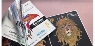 In this image, the monochrome variable print visible on the peeled‑back foil adhesive layer was produced by the K600i; the full‑colour front of the label (featuring the lion) was printed on the N730i.