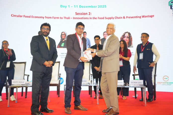 DSC03056–Vijay Sood Vijay Sood presents a momento to Nitin Sanduja of Buhler India alongside the Intrapack exhibition at the first FoodTekPack Conference on 11 December 2025 at the Greater Noida Expo. Standing to their left is Ainan Shahidi. Behind them on the stage, from left to right, are Aditi Jhala, Bhushan Yengade, Himanshi Mahajan, and Sandeep Ghosh Photo PSA/IPAMA