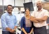 Pioneer Arunachalam’s new Rhyguan, Luster and DYM machines (L to R) Suresh Murugesan, regional director - South India & Sri Lanka, FIG, Sheela Gowri Arun and Arun Tenzing alongside Rhyguan SMART-450 with Luster LabelMaster