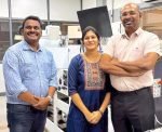 Pioneer Arunachalam’s new Rhyguan, Luster and DYM machines (L to R) Suresh Murugesan, regional director - South India & Sri Lanka, FIG, Sheela Gowri Arun and Arun Tenzing alongside Rhyguan SMART-450 with Luster LabelMaster