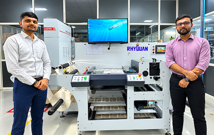 (L to R) Mr. Ajay Patel and Mr. Nirmal Patel with Rhyguan SMART-450 Axigo Multiprint