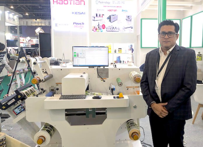 Brijesh Puri, founder of Packnology, at the company's stand at Loupe India packnology